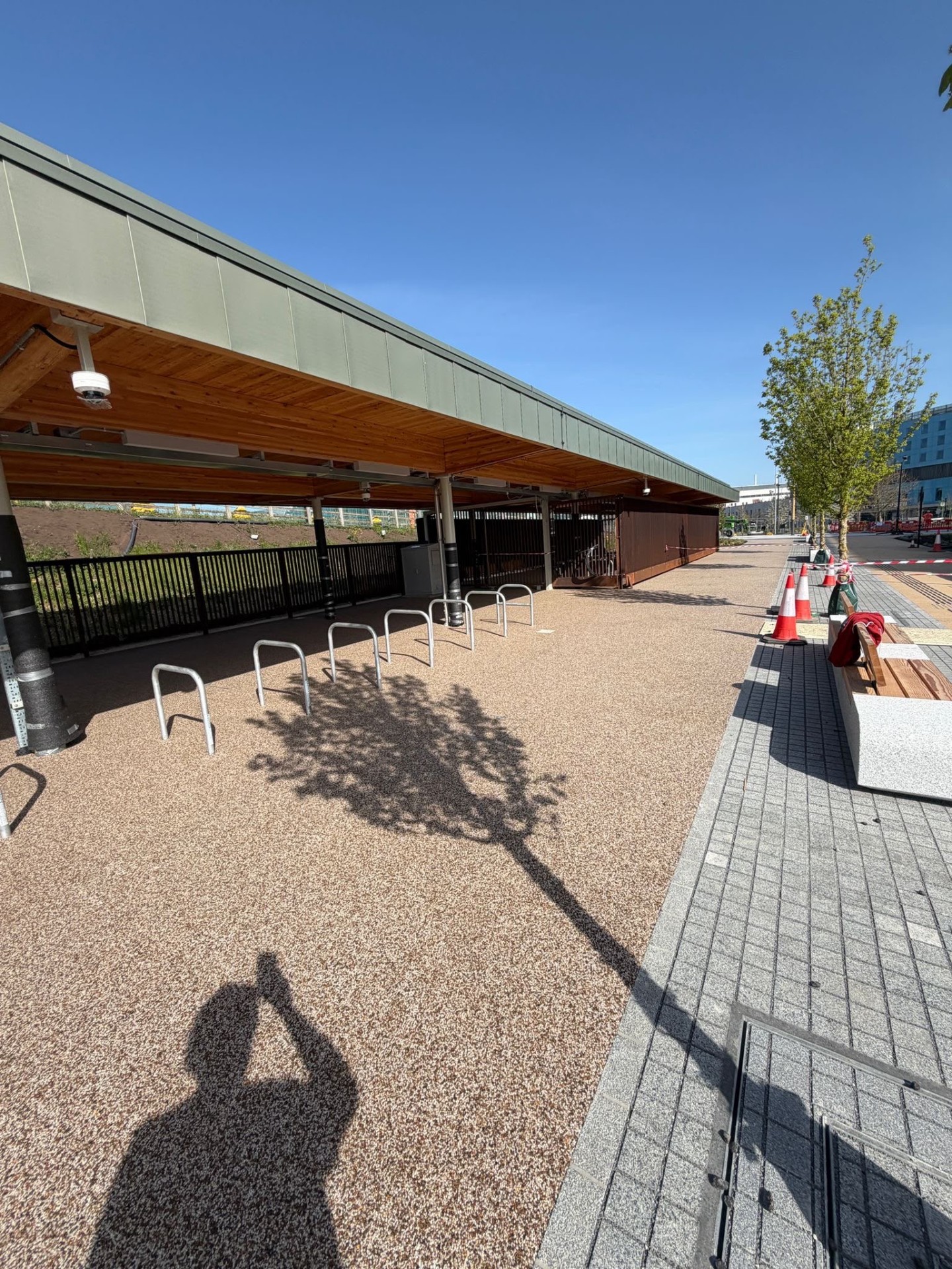 Commercial resin bound plaza with cycle stands and benches