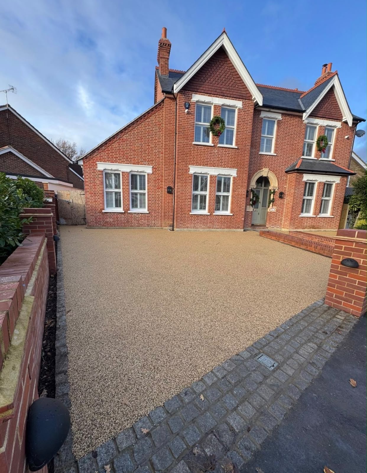 Gold resin bound driveway at a red brick period property