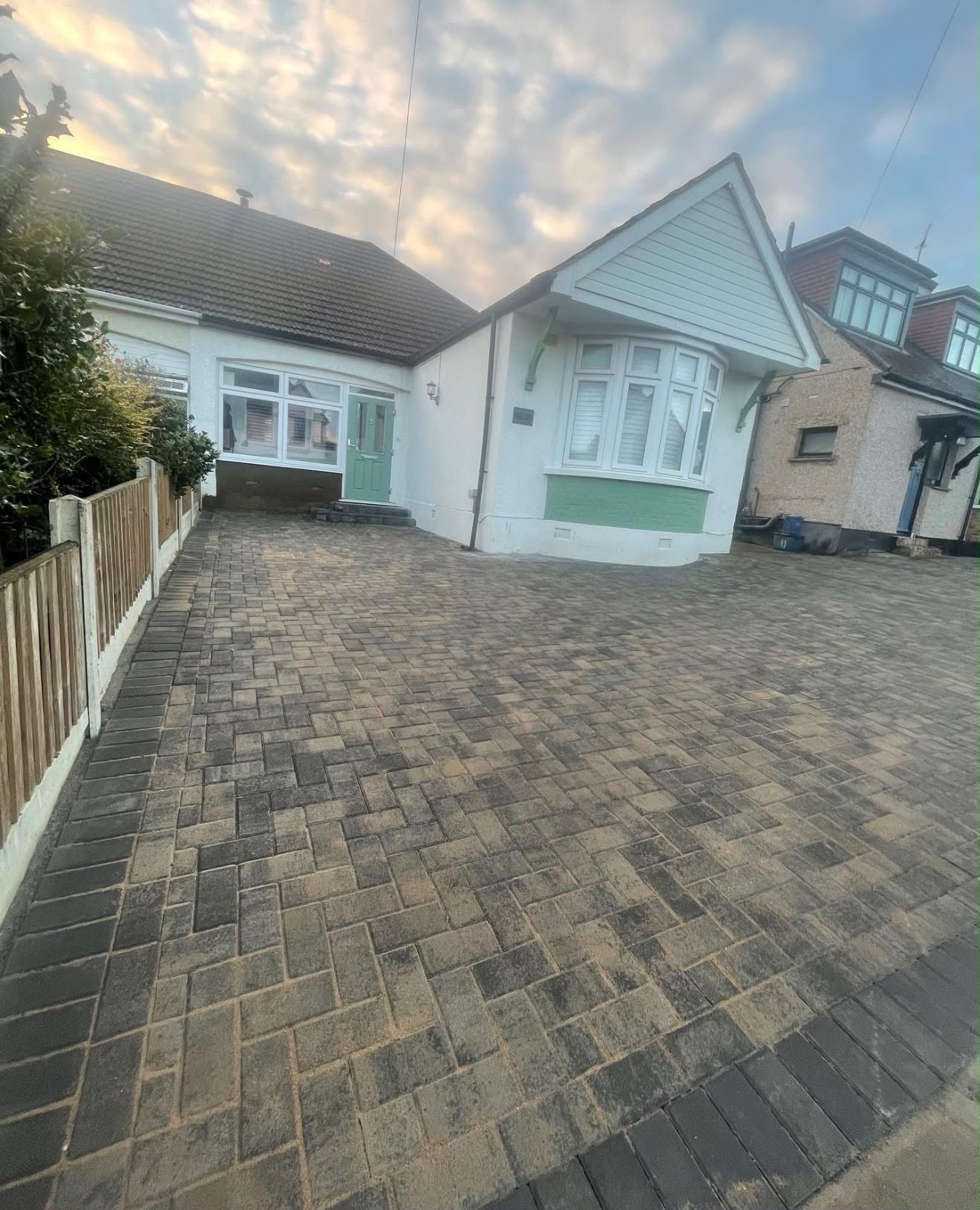 Charcoal block paving driveway at a semi detached bungalow
