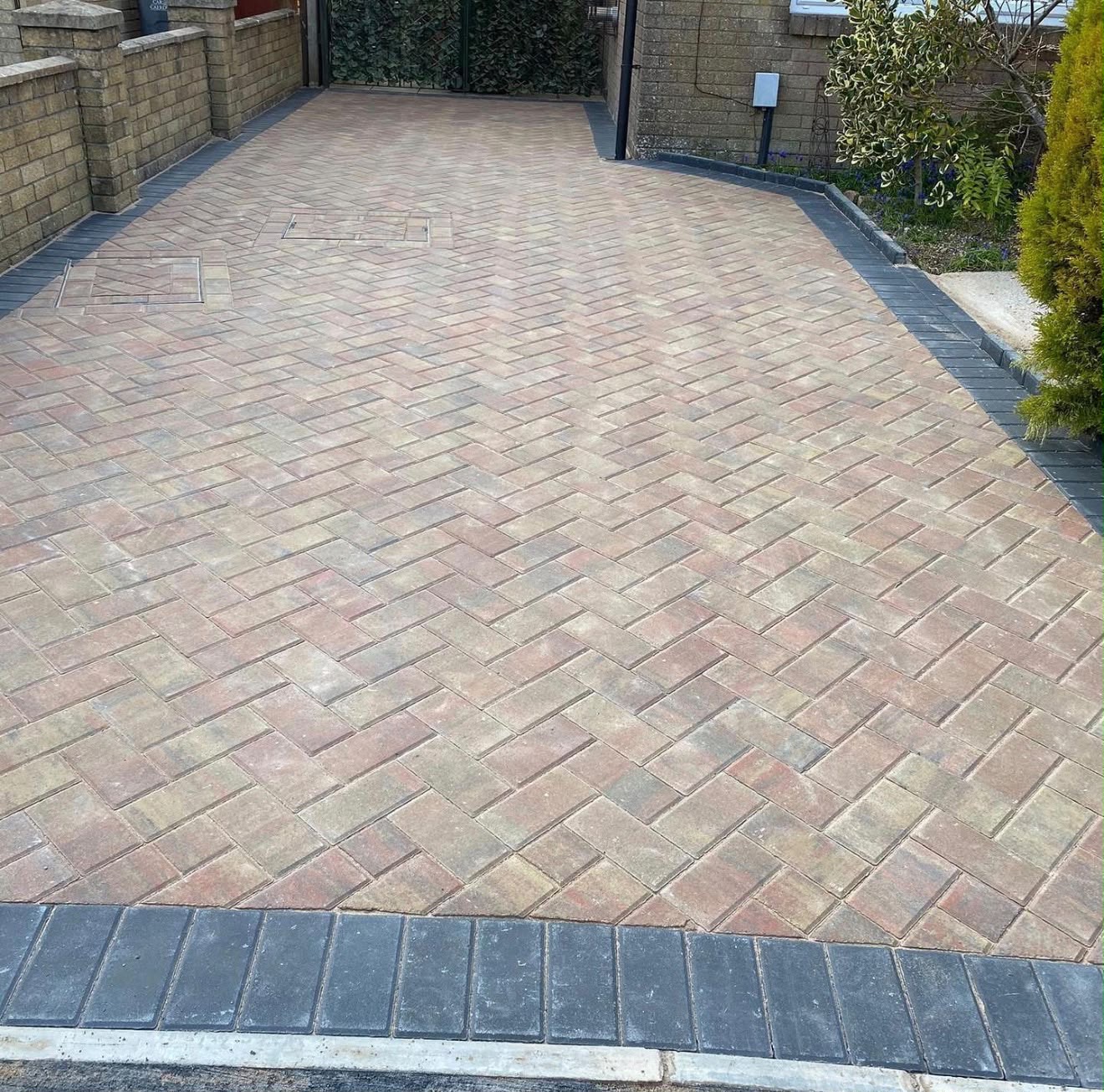 Brindle herringbone block paving driveway with charcoal edging