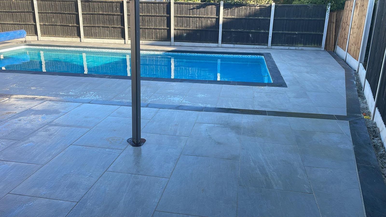 Grey porcelain pool surround with charcoal border detail